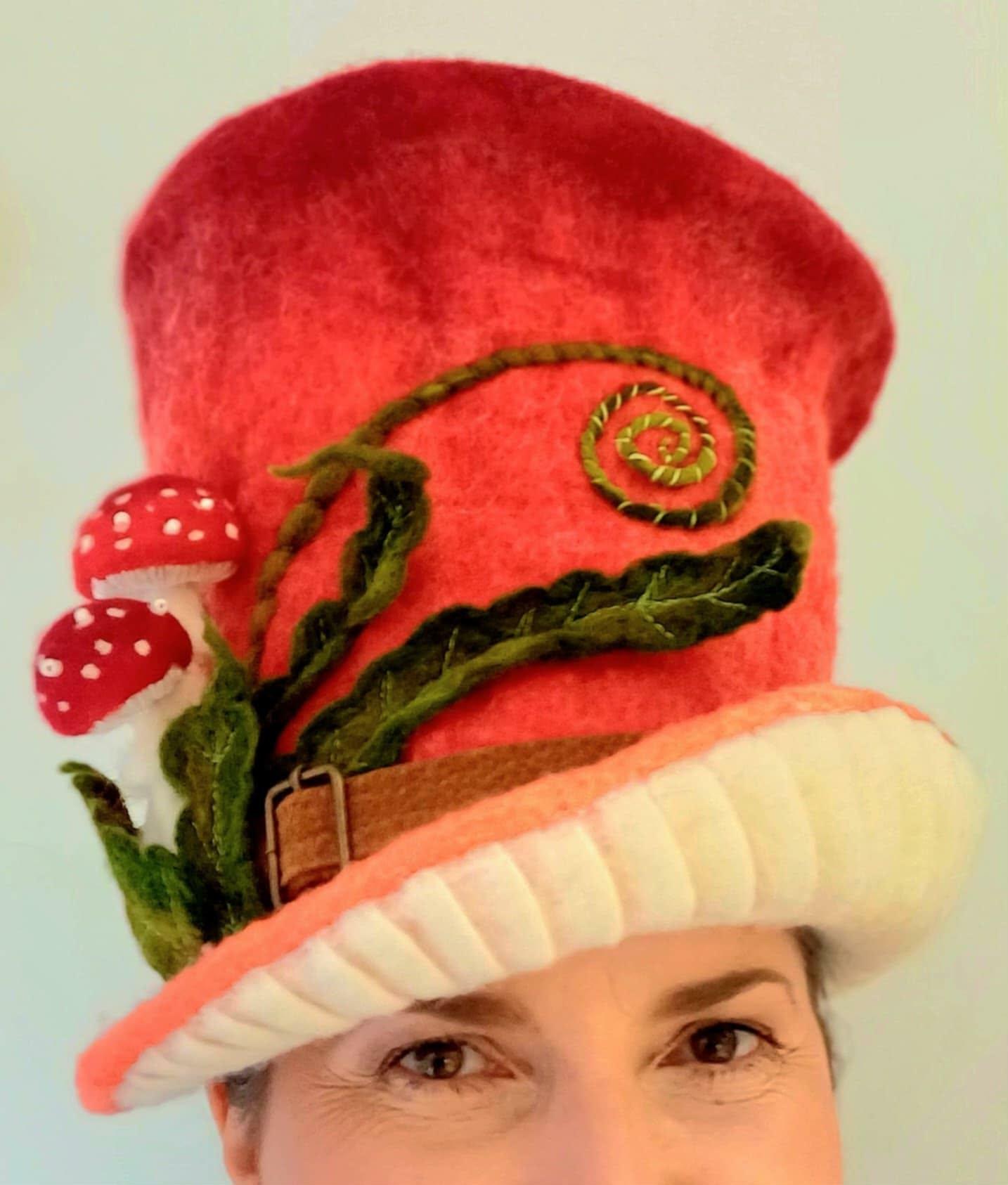 Felted wool hat with mushroom decoration